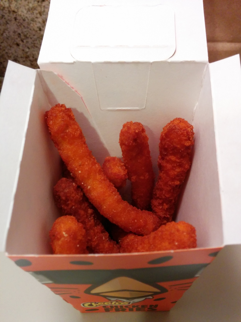 Illustration for article titled SnackTAYku: It's Not Easy Being Cheesy & Chicken but Burger King's Cheetos Chicken Fries Make It Work